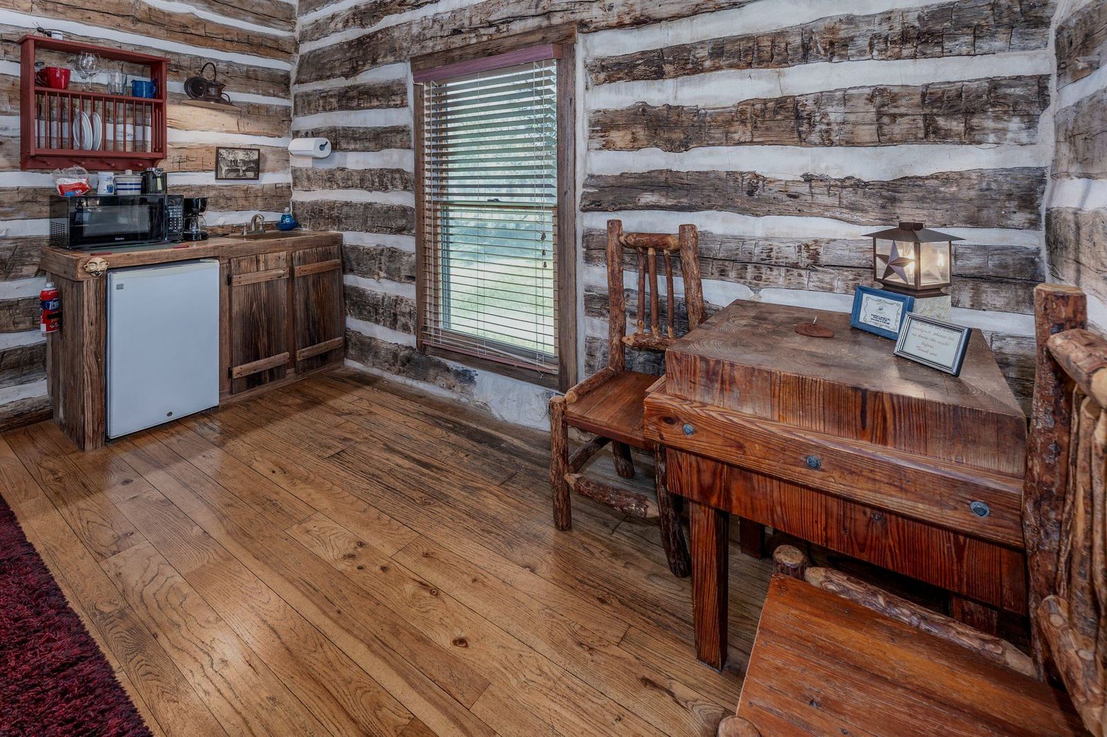 Log cabin interior with wooden table and chairs