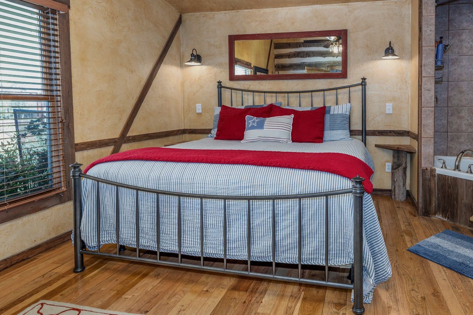 Bedroom with king bed and bathtub