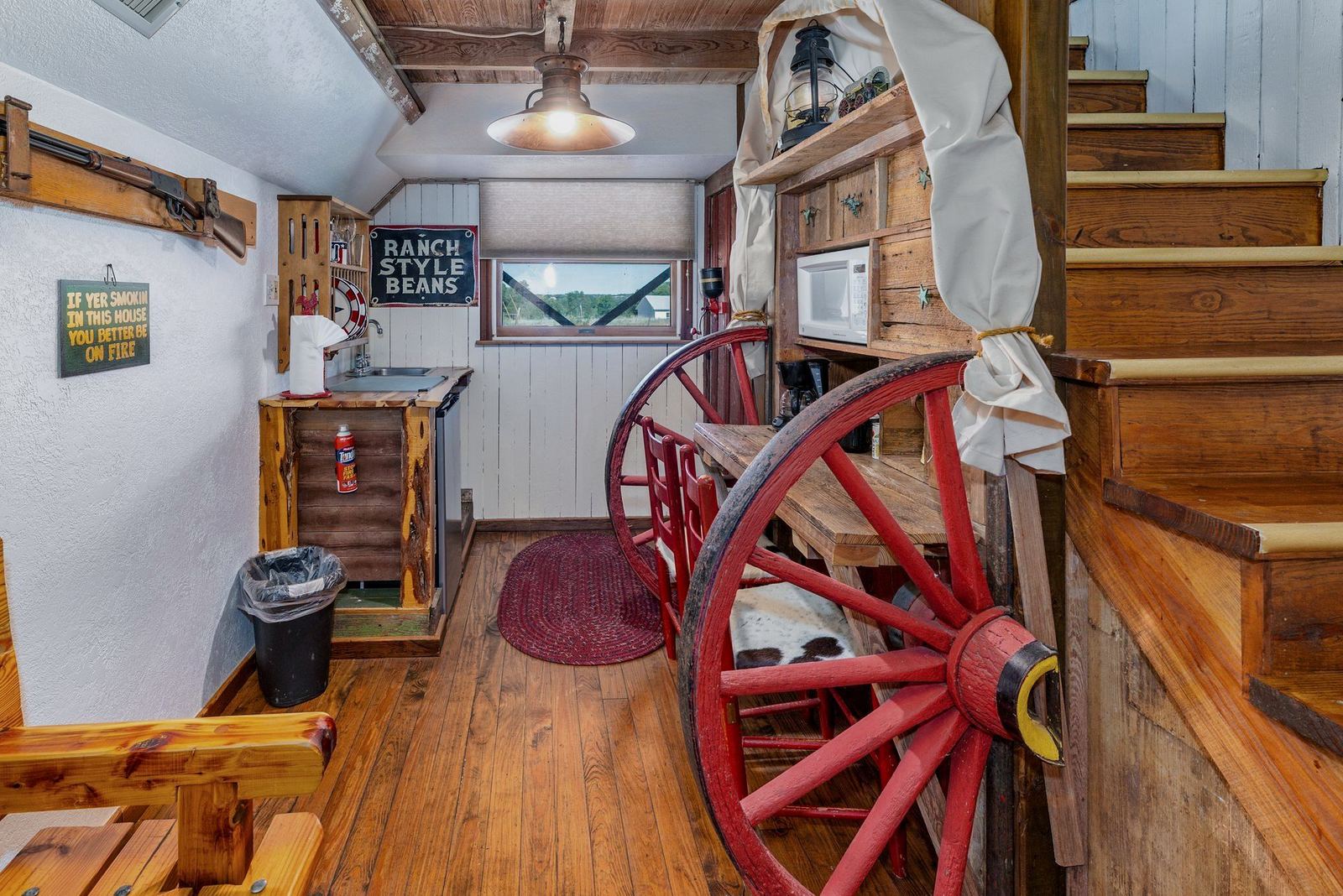 Red wagon wheel inside a guest room