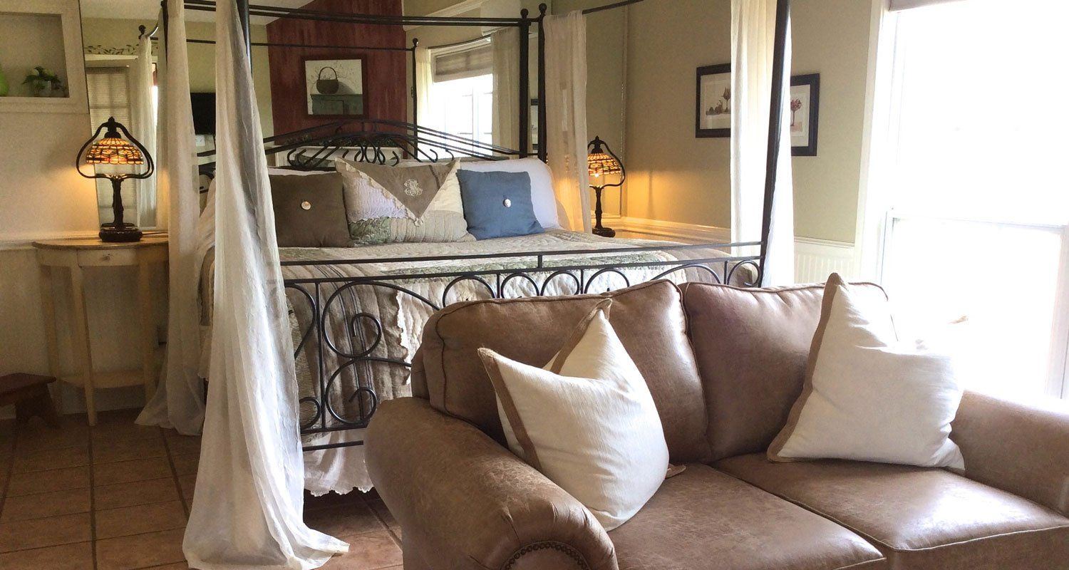 The Pear Tree Cottage bedroom with canopy bed